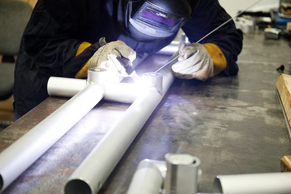 Nimlok metal tubes being welded for trade show display