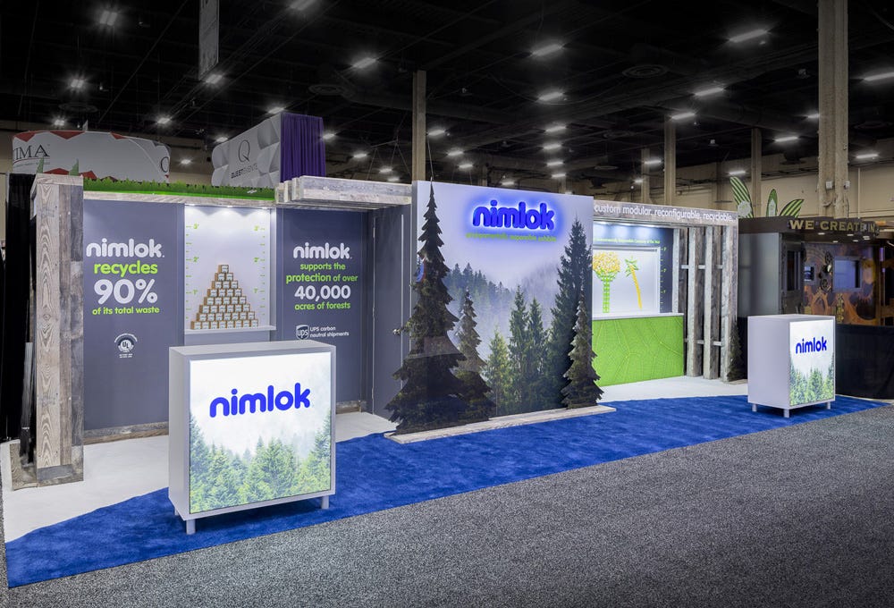 Nimlok 10x30 custom inline trade show booth with fully printed graphic lightboxes